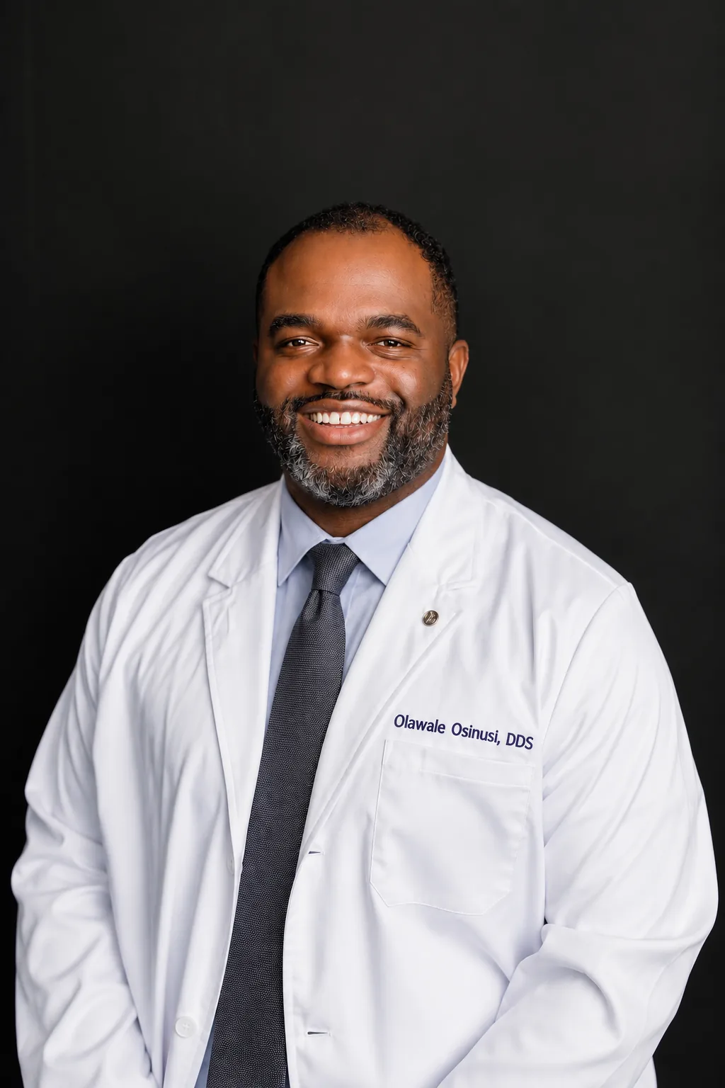 Dr. Olawale Osinusi in a white coat